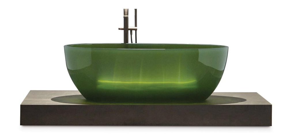 Made of Cristalmood (a transparent colored resin with a glossy finish), the Reflex bathtub by Antonio Lupi boasts soft shapes with a clean and rigorous air