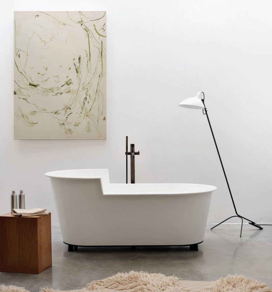 The Ofelia tub from Ceramica Cielo is distinguished by its minimalist lines and made practical by a comfortable back rest and surface space for bath products all around the rim